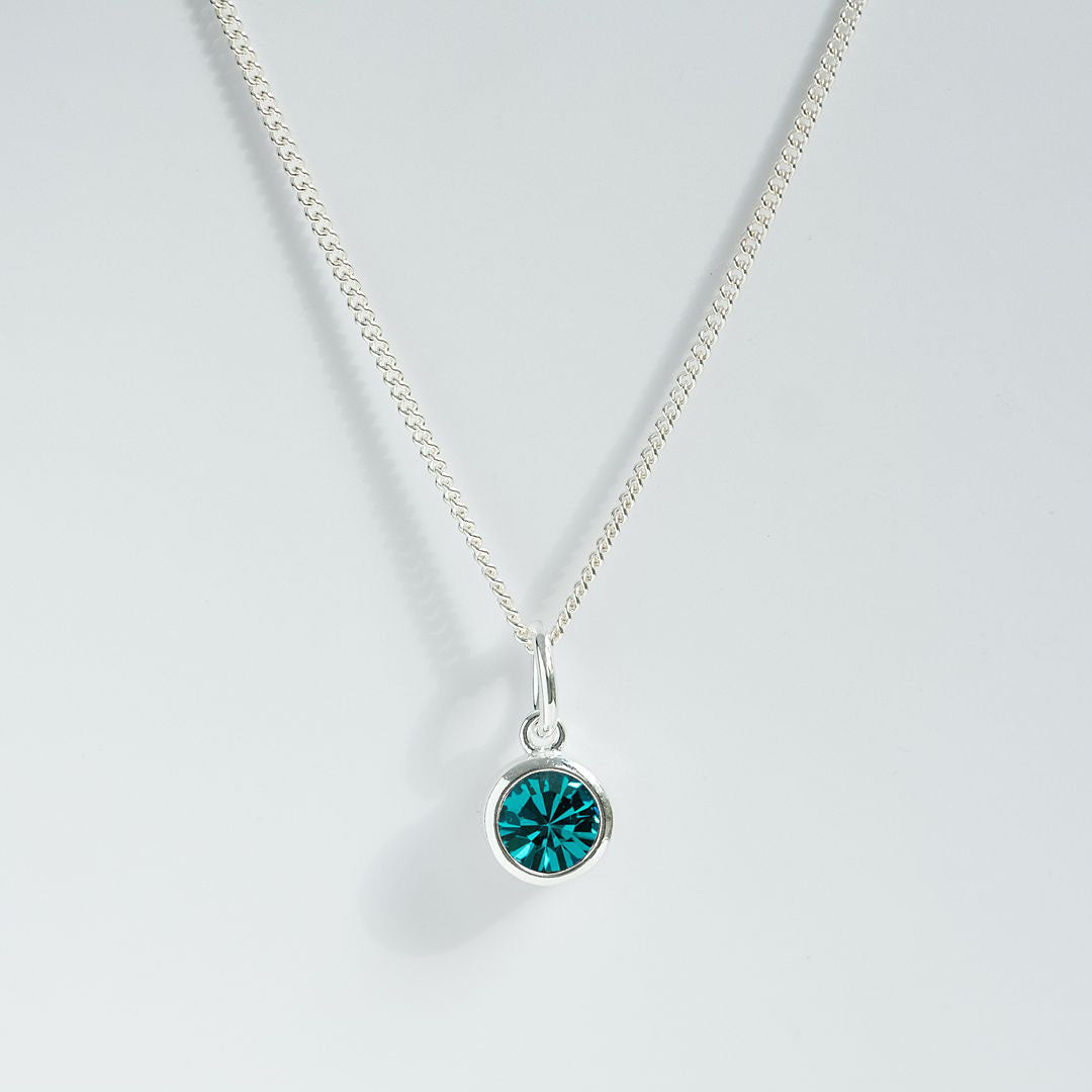 Blue zircon charm pendant