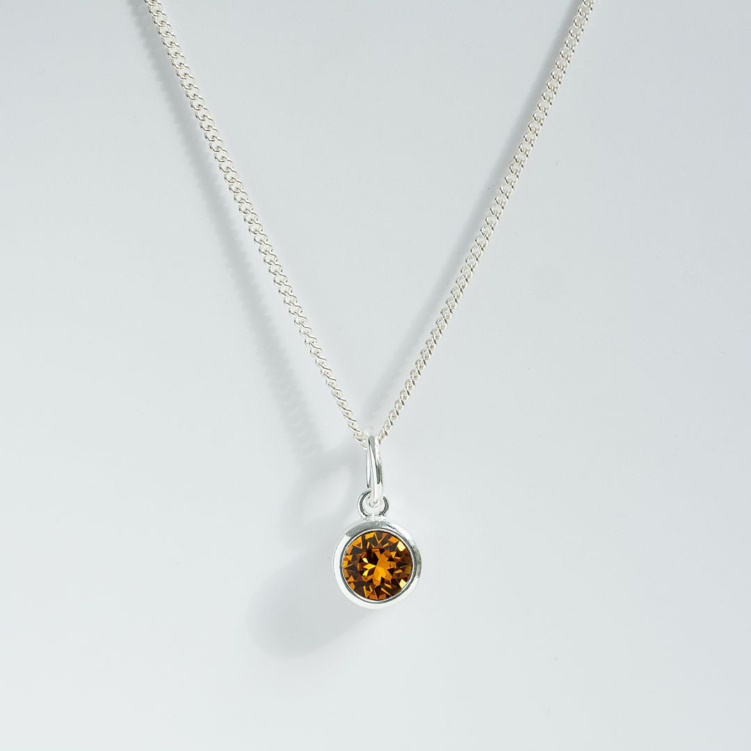 Topaz charm pendant