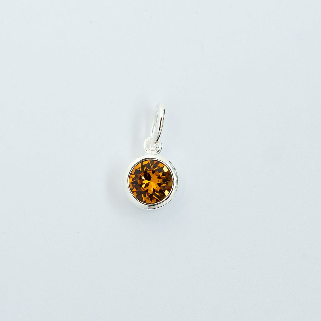 Topaz charm