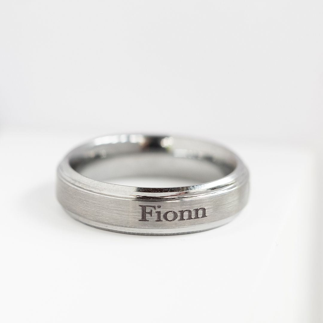 Tungsten ring engraved with the name 'Fionn'