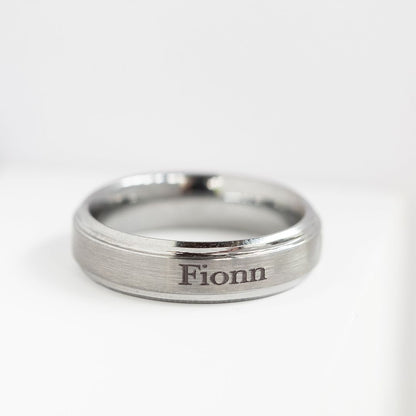 Tungsten ring engraved with the name 'Fionn'