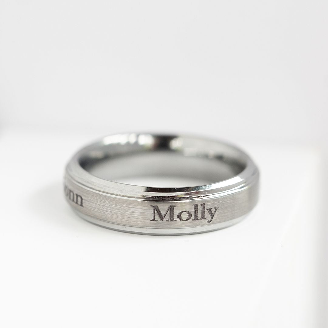 Tungsten ring engraved with the name 'Molly'