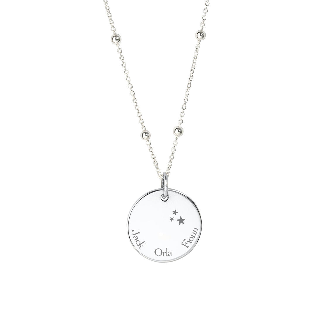 3 kids names engraved on a silver disc pendant