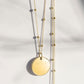Gold disc pendant on a satellite chain