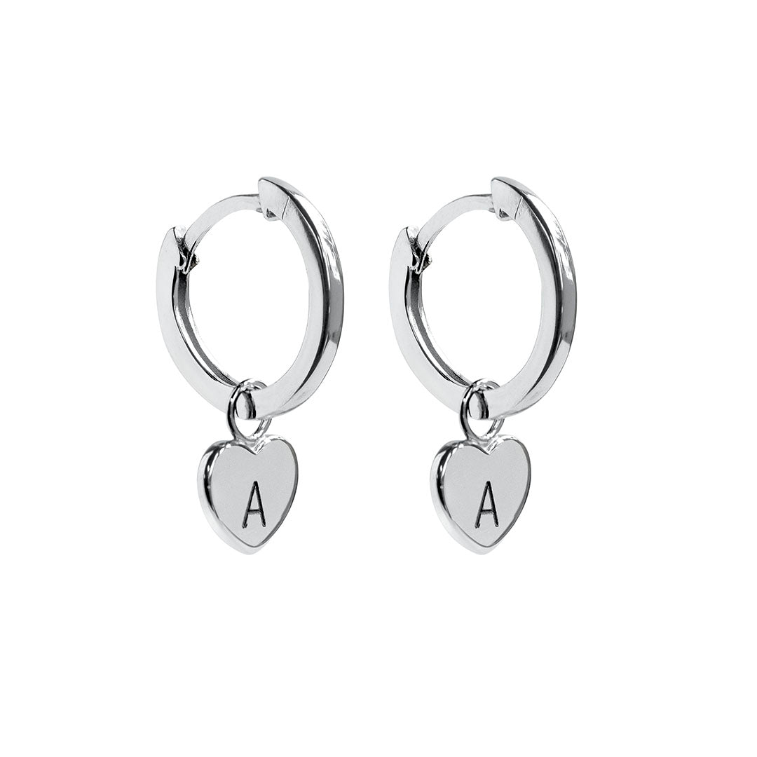 Silver hoop earrings with a heart shaped charm engraved with A