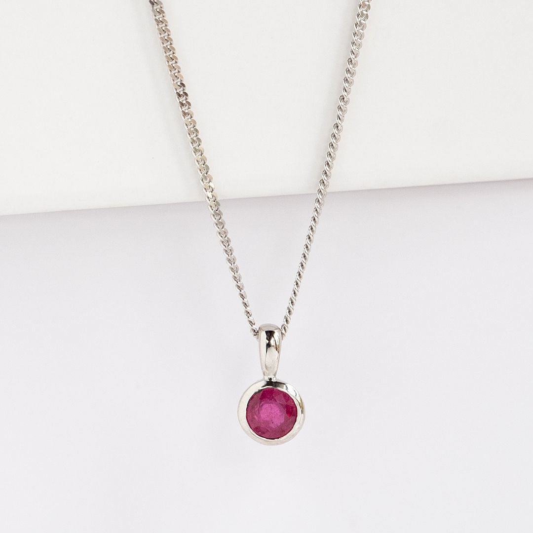 White Gold Ruby Charm on a chain