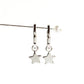 Silver huggie earrings with star charm